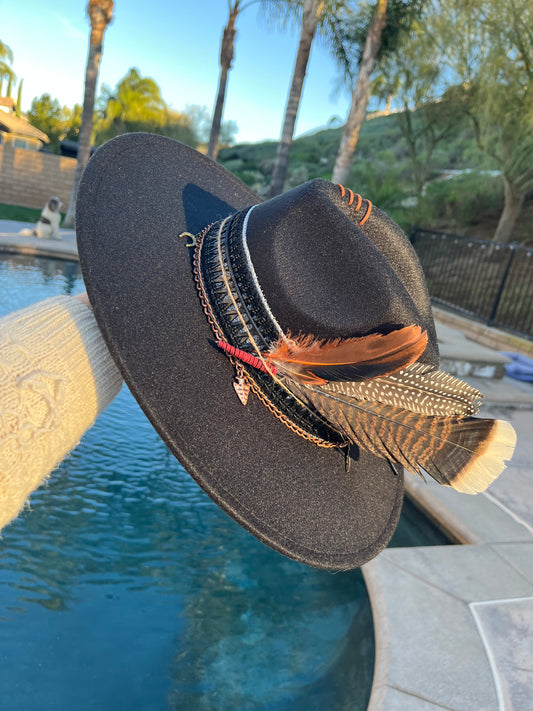Custom BlackFelt Hat with crisscross black band, copper chain with leaf and  horseshoe charms along with beautiful bold feathers
