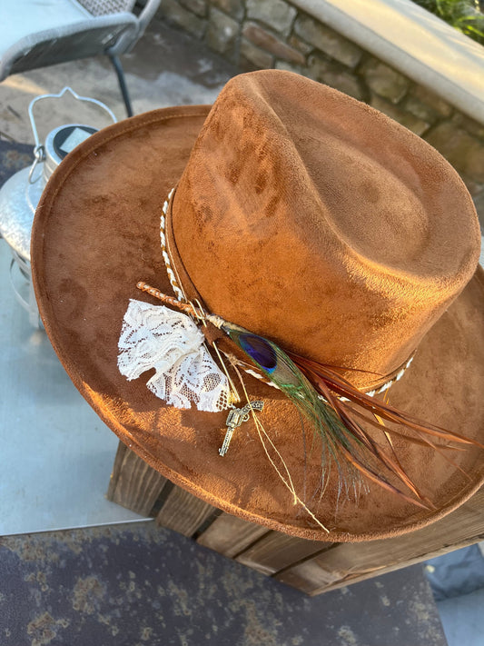 Custom made  brown western boho chic fedora hat with a twist rope band and lace bow along with a pistol charm and  beautiful peacock feather